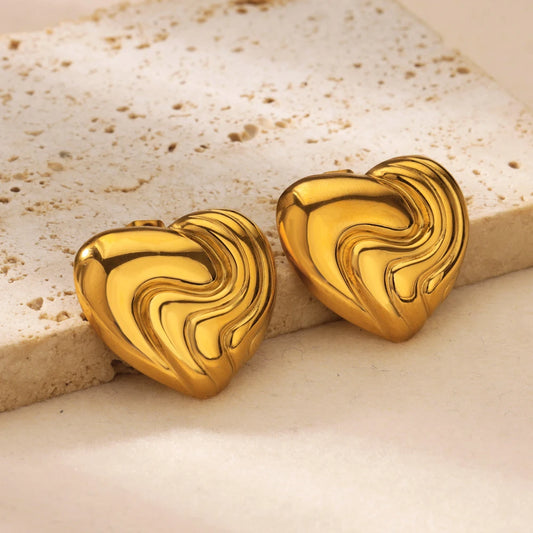gold-colored earrings